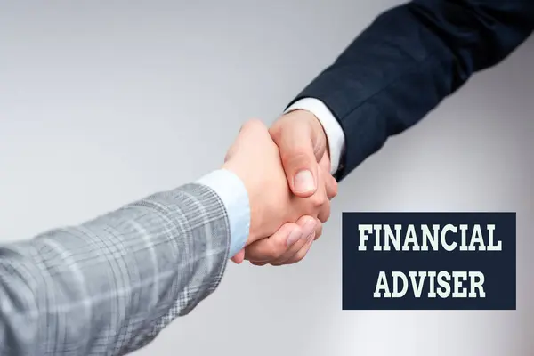 Conceptual caption Financial Adviser. Conceptual photo person who is employed to provide financial services Two Professional Well-Dressed Corporate Businessmen Handshake Indoors — Stock Photo, Image