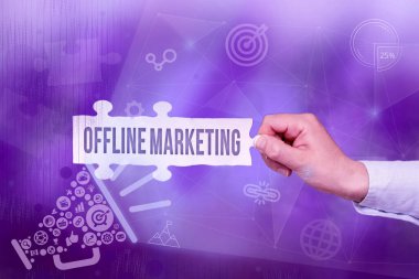 Inspiration showing sign Offline Marketing. Word for Advertising strategy published outside of the internet Hand Holding Jigsaw Puzzle Piece Unlocking New Futuristic Technologies.
