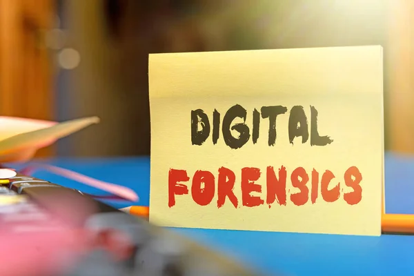 Sign displaying Digital Forensics. Business idea investigation of material found in digital devices Multiple Assorted Collection Office Stationery Photo Placed Over Table — Zdjęcie stockowe