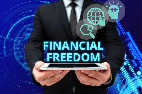 Inspiration showing sign Financial Freedom. Concept meaning make big life decisions without being stressed about money Man In Office Uniform Holding Tablet Displaying New Modern Technology. — Fotografia de Stock