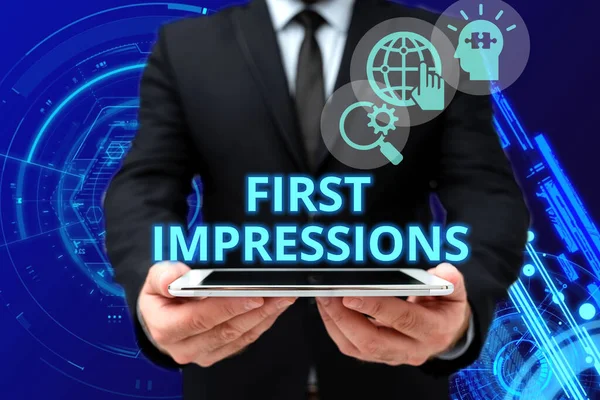 Sign displaying First Impressions. Business overview first consideration or judgment towards a person Man In Office Uniform Holding Tablet Displaying New Modern Technology.