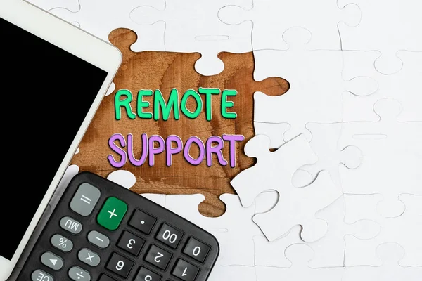 Writing displaying text Remote Support. Business concept type of secure service, which permits representatives to help Building An Unfinished White Jigsaw Pattern Puzzle With Missing Last Piece — Stock Photo, Image