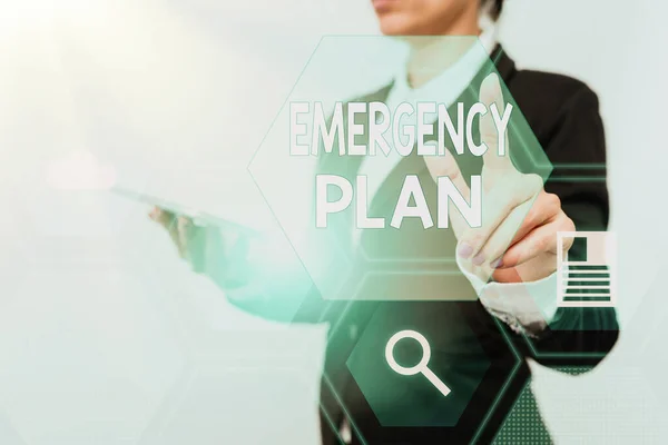 Text sign showing Emergency Plan. Business idea instructions that outlines what workers should do in danger Woman In Suit Holding Tablet Showing Futuristic Interface Display. — Stock Photo, Image