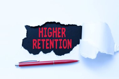 Text showing inspiration Higher Retention. Business approach ability of an organization to retain its employees Tear on sheet reveals background with pen on board