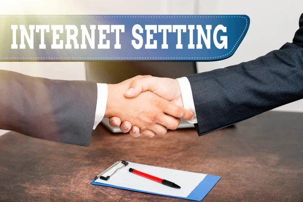 Text sign showing Internet Setting. Business concept etermines how it connects to your wireless carrier for data Two Professional Well-Dressed Corporate Businessmen Handshake Indoors — Photo