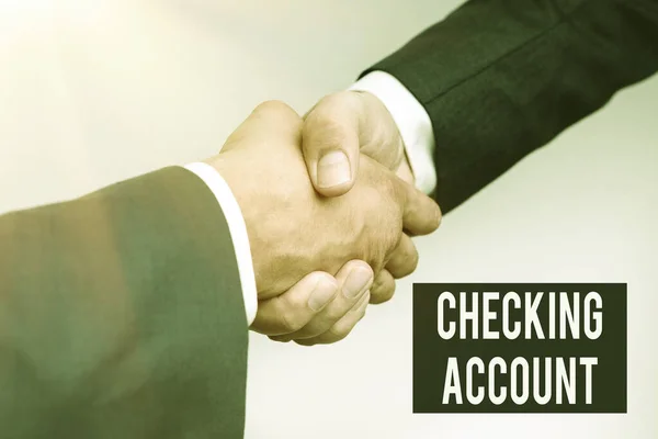 Text caption presenting Checking Account. Conceptual photo bank account that allows you easy access to your money Two Professional Well-Dressed Corporate Businessmen Handshake Indoors — Stock Photo, Image