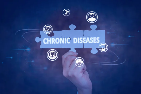 Inspiration showing sign Chronic Diseases. Conceptual photo A disease or condition that lasts for longer time Hand Holding Jigsaw Puzzle Piece Unlocking New Futuristic Technologies. — Stock fotografie
