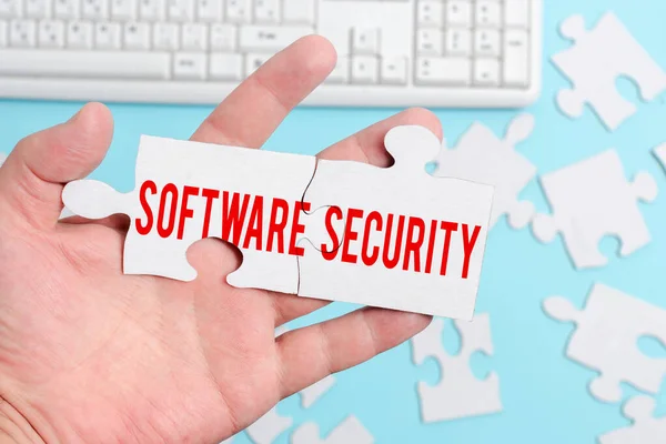 Text sign showing Software Security. Word Written on implemented to protect software against malicious attack Building An Unfinished White Jigsaw Pattern Puzzle With Missing Last Piece — Stockfoto