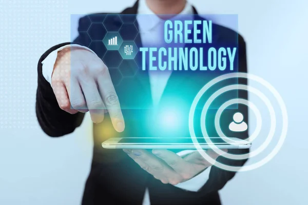 Conceptual caption Green Technology. Word Written on reverse the effects of human activity on the environment Lady In Suit Pointing On Tablet Showing Futuristic Graphic Interface. — 图库照片