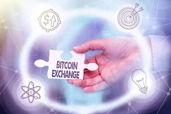 Text caption presenting Bitcoin Exchange. Business approach digital marketplace where traders can buy and sell bitcoins Hand Holding Jigsaw Puzzle Piece Unlocking New Futuristic Technologies.