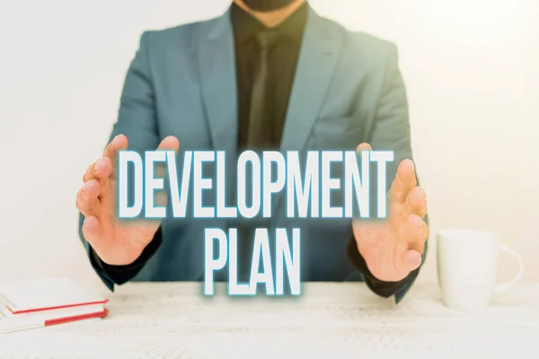 Writing displaying text Development Plan. Word Written on the planning of the development of an area of land Discussing Important Idea Presenting And Explaining Business Plan Designs