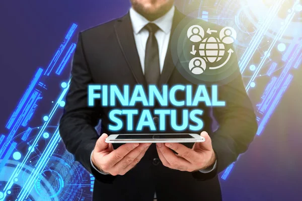 Text sign showing Financial Status. Business concept level of income into which applicants are categorized Man In Office Uniform Holding Tablet Displaying New Modern Technology. — 图库照片