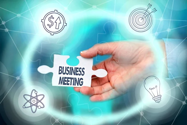 Inspiration showing sign Business Meeting. Word Written on gathering of two or more showing to discuss business ideas Hand Holding Jigsaw Puzzle Piece Unlocking New Futuristic Technologies. — 图库照片