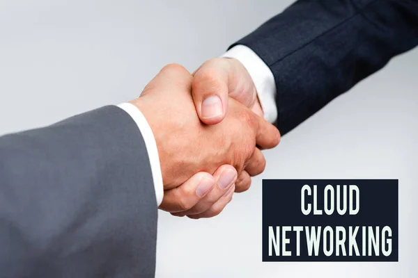 Text sign showing Cloud Networking. Business overview sourcing and utilization of one or more network resources Two Professional Well-Dressed Corporate Businessmen Handshake Indoors — стоковое фото