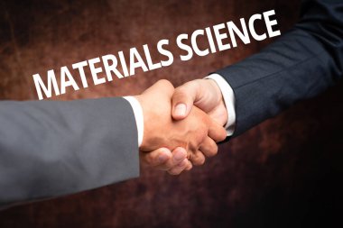 İlham verici materyal bilimini gösteren metin. Madde İki Profesyonel İyi Giyimli İşadamı 'nın özelliklerini içeren disiplinler arası bir iş fikri.