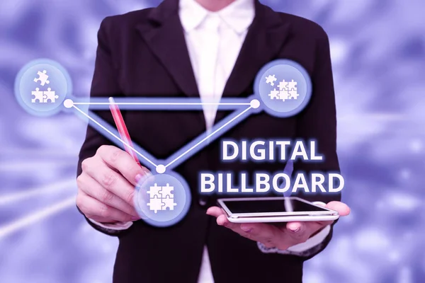 Hand writing sign Digital Billboard. Concept meaning billboard that displays digital images for advertising Lady In Uniform Holding Tablet In Hand Virtually Typing Futuristic Tech.