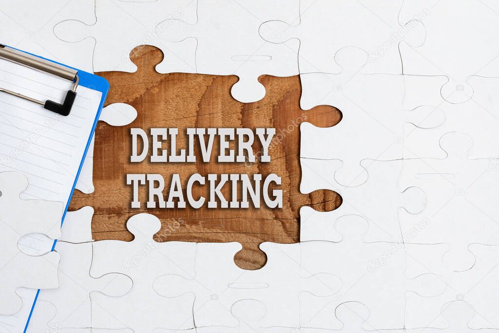 Text sign showing Delivery Tracking. Business approach the process of localizing shipping containers and mails Building An Unfinished White Jigsaw Pattern Puzzle With Missing Last Piece