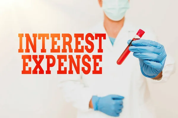 Text showing inspiration Interest Expense. Business approach cost of debt that has occurred during a period of time Studying Toxic Virus Analyzing Viral Discovery New Laboratory Experiments — Stock Photo, Image