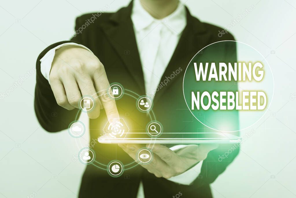 Hand writing sign Warning Nosebleed. Business concept caution on bleeding from the blood vessels in the nose Lady In Suit Pointing On Tablet Showing Futuristic Graphic Interface.