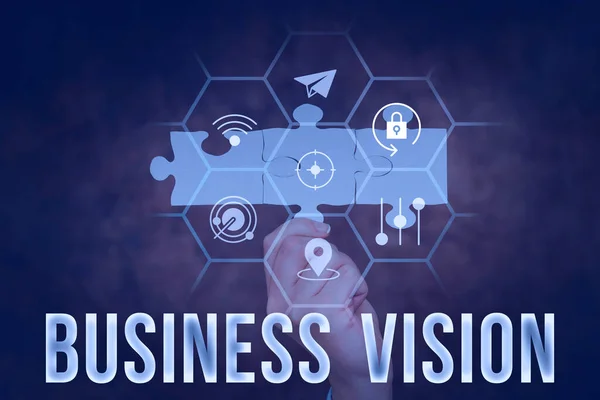 Text sign showing Business Vision. Business overview description of what an organization would like to achieve Hand Holding Jigsaw Puzzle Piece Unlocking New Futuristic Technologies. — Stock Photo, Image