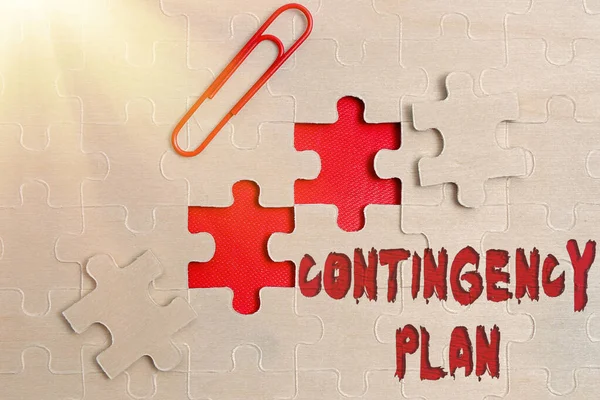 Sign displaying Contingency Plan. Word Written on A plan designed to take account of a possible future event Building An Unfinished White Jigsaw Pattern Puzzle With Missing Last Piece