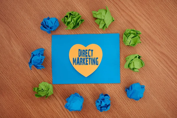 Text sign showing Direct Marketing. Business overview business of selling products directly to the public Colorful Crumpled Papers Circular Pattern Surrounding Heart Shaped Card. — Stock Photo, Image