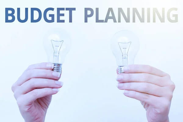 Text sign showing Budget Planning. Conceptual photo process of constructing a budget and then utilizing it two Hands holding lamp showing or presenting new technology ideas — Stock Photo, Image