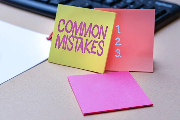 Inspiration showing sign Common Mistakes. Business approach actions that are often used interchangeably with error Multiple Assorted Collection Office Stationery Photo Placed Over Table — Stock Photo, Image