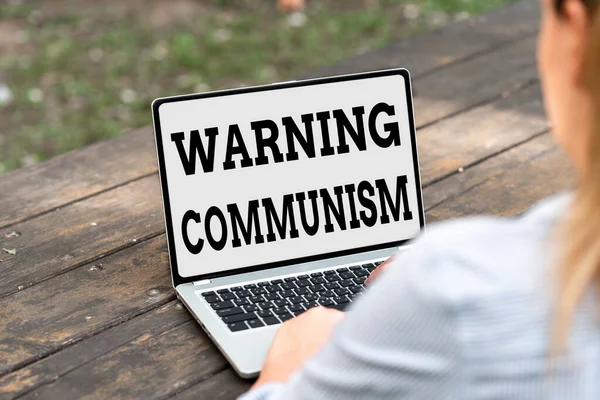Sign displaying Warning Communism. Word for economic system where the group owns the production Online Jobs And Working Remotely Connecting People Together