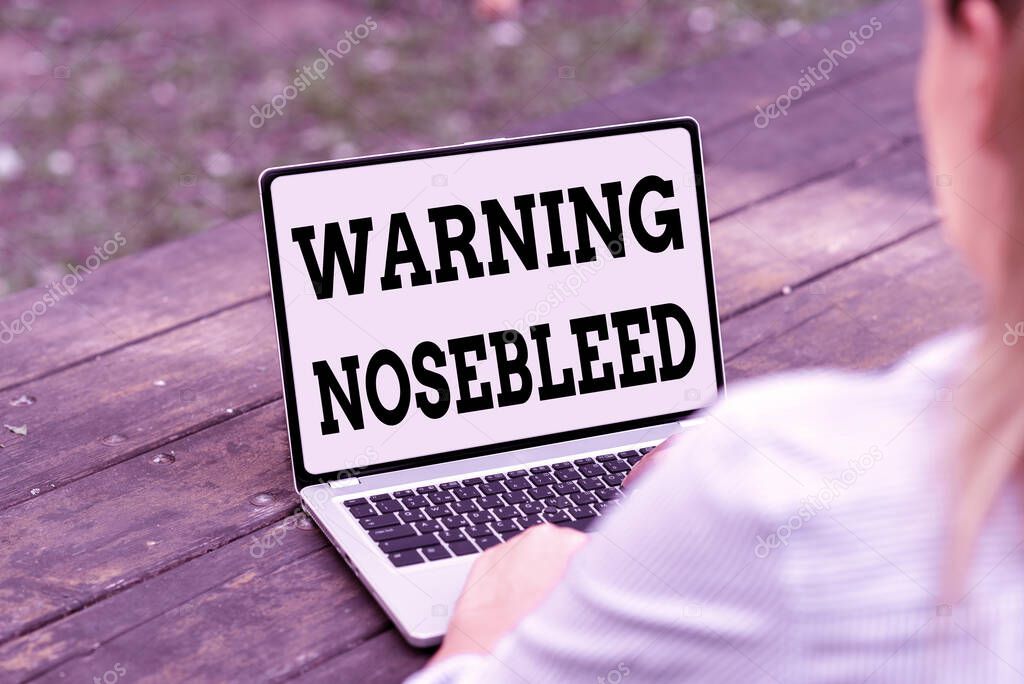 Hand writing sign Warning Nosebleed. Business showcase caution on bleeding from the blood vessels in the nose Online Jobs And Working Remotely Connecting People Together