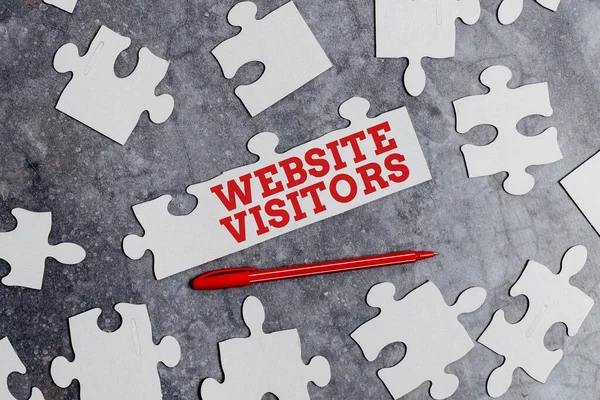 Writing displaying text Website Visitors. Business approach someone who visits views or goes to your website or page Building An Unfinished White Jigsaw Pattern Puzzle With Missing Last Piece — Stock Photo, Image