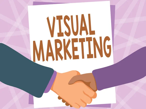 Znak firmowy Visual Marketing. Słowo do opowiadania historii swojej marki lub produktu przez stworzenie Dwóch mężczyzn rysowania z pustym papierem uścisk dłoni przedstawiając umowy. — Zdjęcie stockowe
