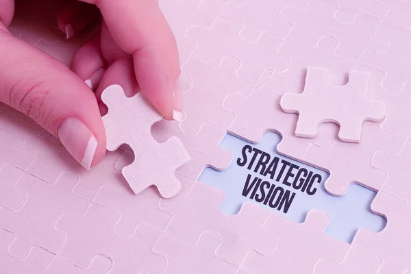Conceptual display Strategic Vision. Business overview clarifies the direction the organisation needs to move Building An Unfinished White Jigsaw Pattern Puzzle With Missing Last Piece — Stock Photo, Image
