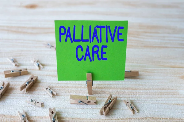 Handwriting text Palliative Care. Business showcase specialized medical care for showing with a serious illness Piece Of Blank Square Note Surrounded By Laundry Clips Showing New Idea. — Stock Photo, Image