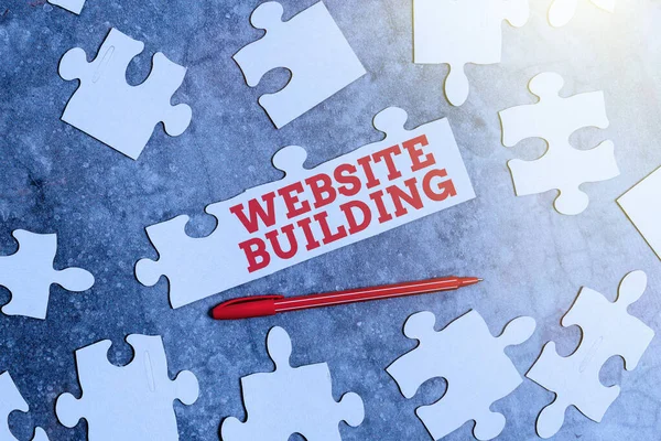 Conceptual caption Website Building. Business approach tools that typically allow the construction of websites Building An Unfinished White Jigsaw Pattern Puzzle With Missing Last Piece — Stock Photo, Image