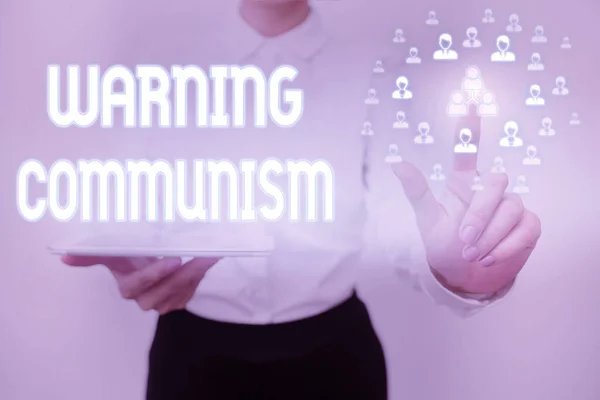 Conceptual display Warning Communism. Word for economic system where the group owns the production Lady Holding Tablet Pressing On Virtual Button Showing Futuristic Tech. — Stock Photo, Image