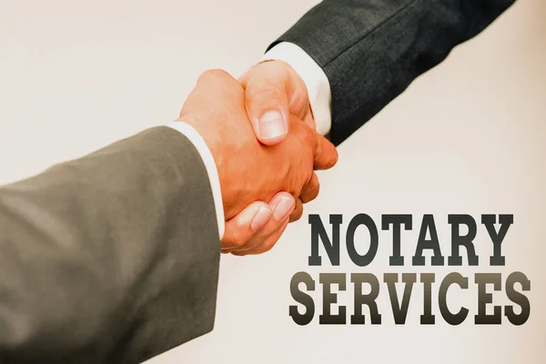 Handwriting text Notary Services. Word Written on services rendered by a state commissioned notary public Two Professional Well-Dressed Corporate Businessmen Handshake Indoors — Stock Photo, Image