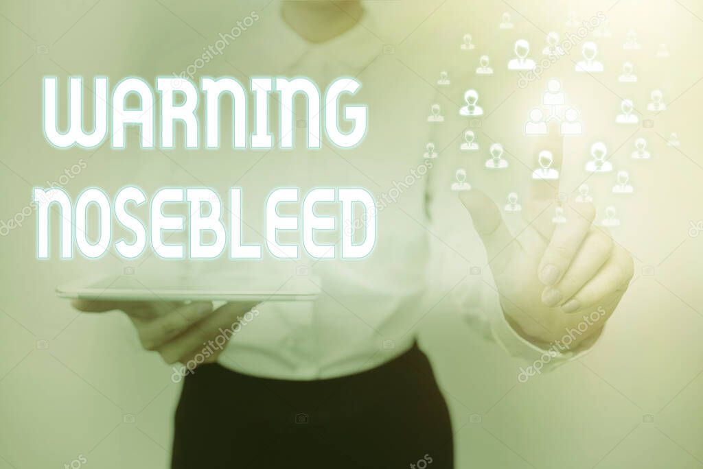 Text showing inspiration Warning Nosebleed. Business approach caution on bleeding from the blood vessels in the nose Lady Holding Tablet Pressing On Virtual Button Showing Futuristic Tech.