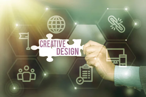 Text showing inspiration Creative Design. Business concept subset of visual communication and communication design Hand Holding Jigsaw Puzzle Piece Unlocking New Futuristic Technologies.