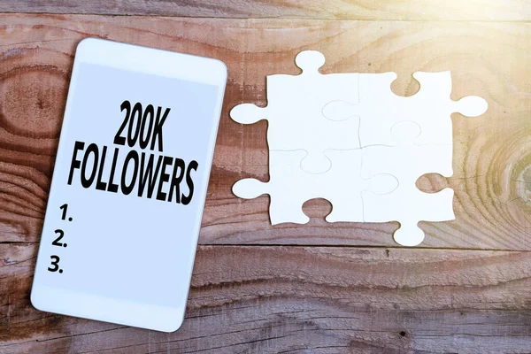 Writing displaying text 200K Followers. Concept meaning number of individuals who follows someone in Instagram Building An Unfinished White Jigsaw Pattern Puzzle With Missing Last Piece — Stock Photo, Image