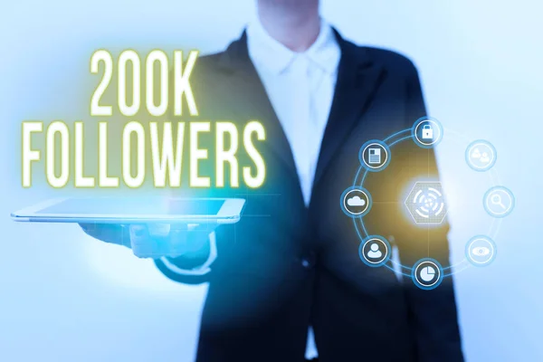 Conceptual display 200K Followers. Business approach number of individuals who follows someone in Instagram Woman In Uniform Displaying Mobile Device Futuristic Virtual Tech. — Stock Photo, Image