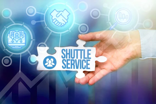 Text sign showing Shuttle Service. Conceptual photo intended to shuttle passengers between two fixed points Hand Holding Jigsaw Puzzle Piece Unlocking New Futuristic Technologies.