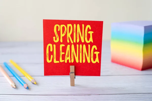 Conceptual display Spring Cleaning. Concept meaning thorough cleaning of a house or room during spring Blank Sticky Note Laundry Clip Stack Of Colorful Paper Pen Placed On Desk. — Stock Photo, Image