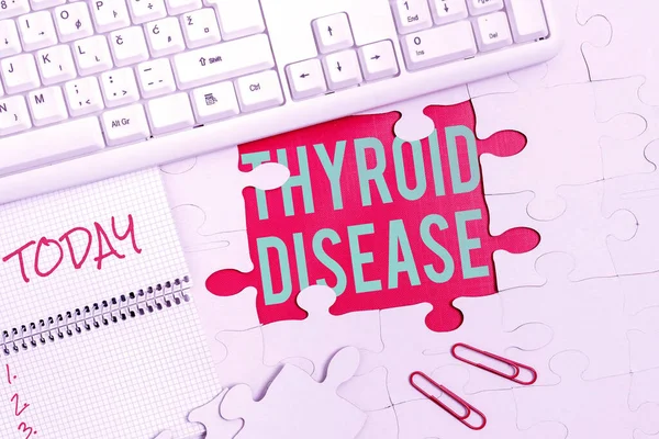 Text sign showing Thyroid Disease. Internet Concept the thyroid gland fails to produce enough hormones Building An Unfinished White Jigsaw Pattern Puzzle With Missing Last Piece