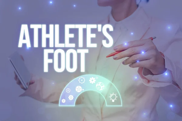 Text bildtext som presenterar idrottaren S Is Foot. Företag visar upp en svampinfektion i foten märkt med blister Lady I Uniform Holding Pen Telefon Visar Futuristic Virtual Interface. — Stockfoto