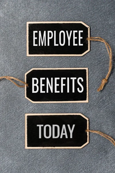 Writing displaying text Employee Benefits. Business concept indirect and noncash compensation paid to an employee Collection of Blank Empty Sticker Tags Tied With A String For Information Label Sign