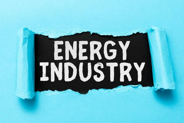 Conceptual caption Energy Industry. Business showcase industries involved in the production and sale of energy Tear on sheet reveals background behind the front side — Stock Photo, Image