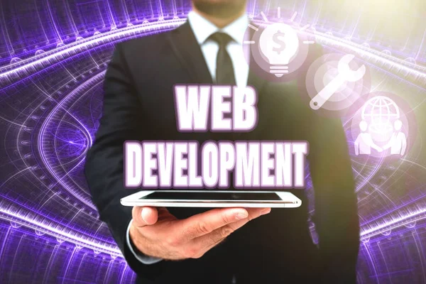 Text showing inspiration Web Development. Business approach dealing with developing websites for hosting via intranet Man In Office Uniform Holding Tablet Displaying New Modern Technology. — Stock Photo, Image