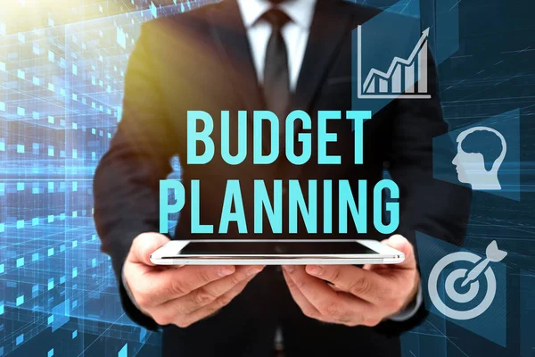 Handwriting text Budget Planning. Business approach The written description about current and future expenses Man In Office Uniform Holding Tablet Displaying New Modern Technology. — Stock Photo, Image