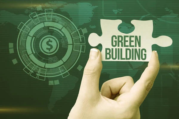 Escrevendo exibindo texto Green Building. Palavra para uma estrutura que é ambientalmente responsável Sustentável Mão Segurando Quebra-cabeça Peça Desbloqueando Novas Tecnologias Futuristas. — Fotografia de Stock